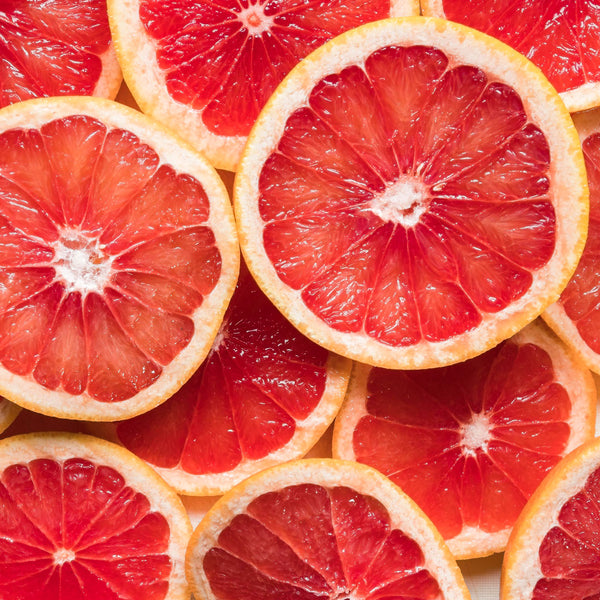 Slices of deep red grapefruits, scientifically known as Citrus paradisi creates NATIVE EXTRACTS Grapefruit Seed Cellular Extract